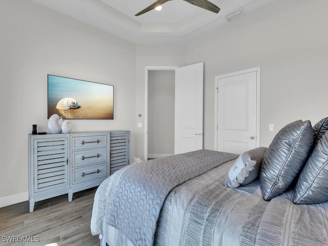 bedroom with ceiling fan and light hardwood / wood-style flooring