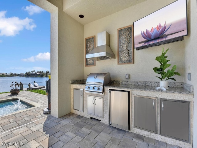 view of patio / terrace featuring a water view and area for grilling