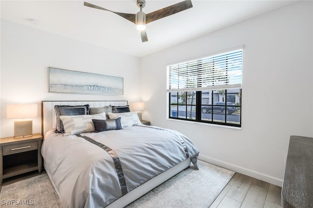 bedroom featuring ceiling fan and light hardwood / wood-style floors