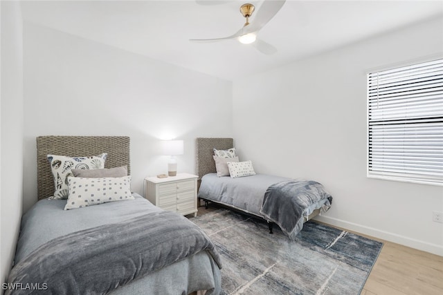 bedroom featuring hardwood / wood-style flooring and ceiling fan