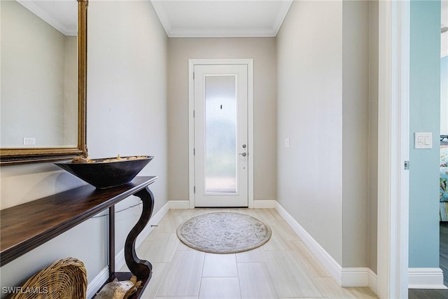 foyer entrance with crown molding, light tile patterned flooring, and baseboards