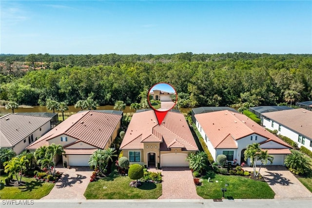 aerial view featuring a residential view and a forest view