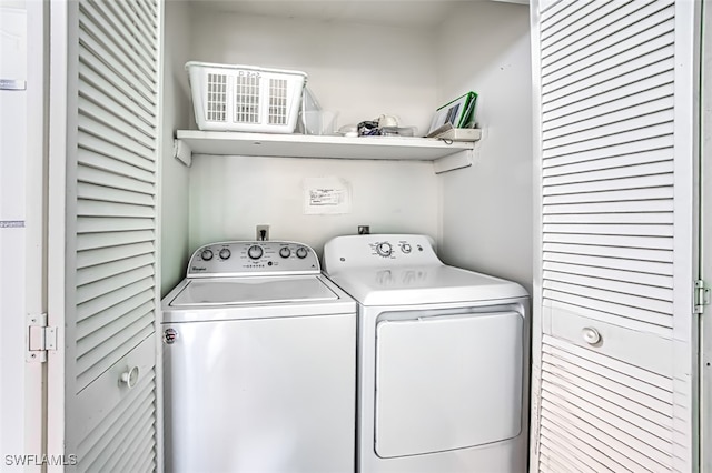 washroom featuring washing machine and dryer