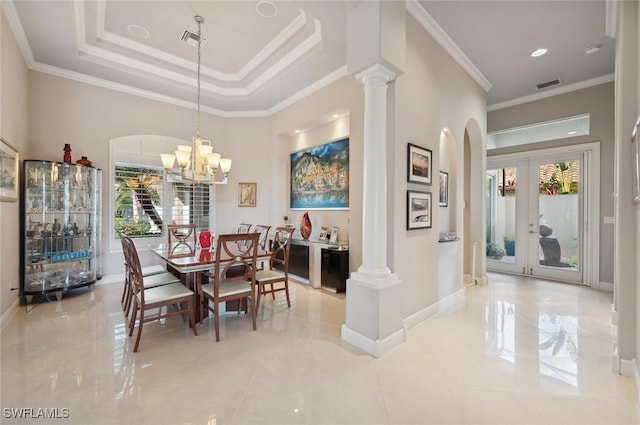 dining area with decorative columns, ornamental molding, and a wealth of natural light