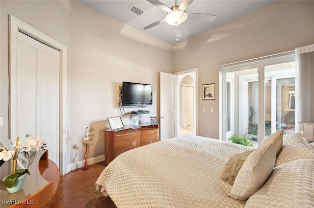 bedroom featuring ceiling fan and dark hardwood / wood-style floors