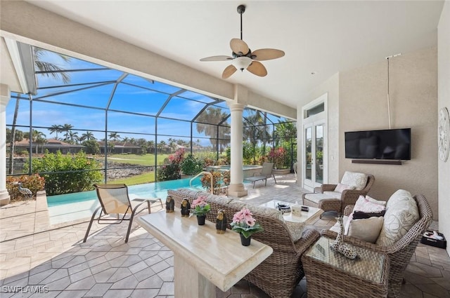 view of patio with french doors, ceiling fan, an outdoor living space, and glass enclosure