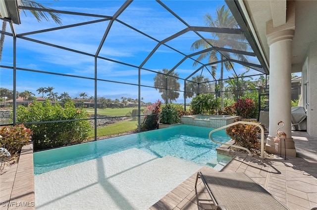 view of pool featuring an in ground hot tub, a lanai, and a patio area