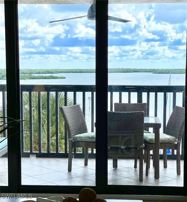 balcony featuring a water view