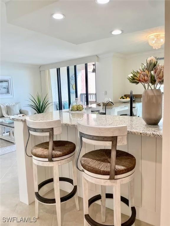 interior space featuring light stone countertops and light tile patterned floors