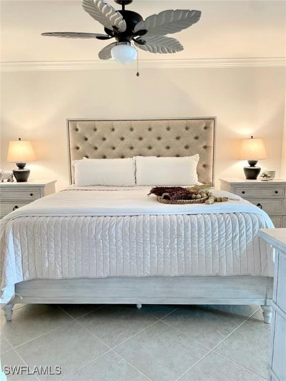 unfurnished bedroom featuring light tile patterned flooring, ceiling fan, and ornamental molding