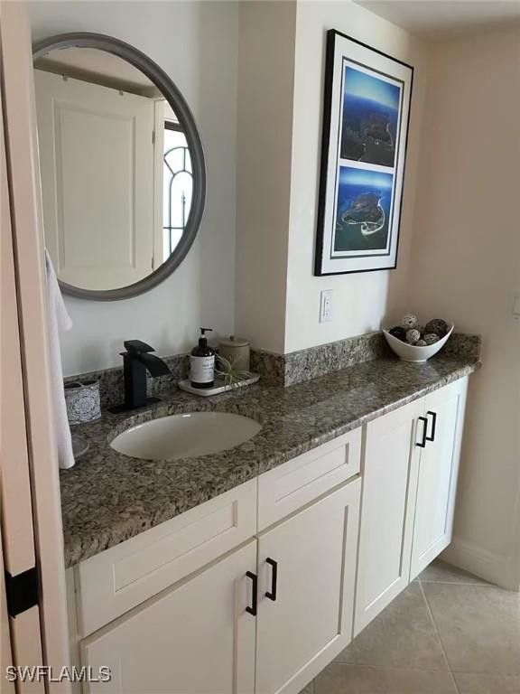 bathroom with vanity and tile patterned floors