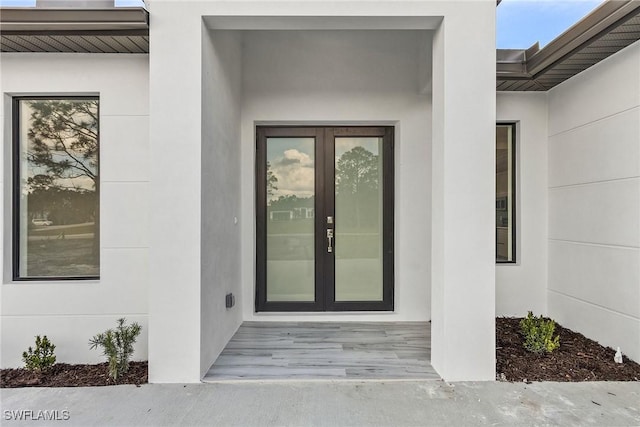 property entrance featuring french doors