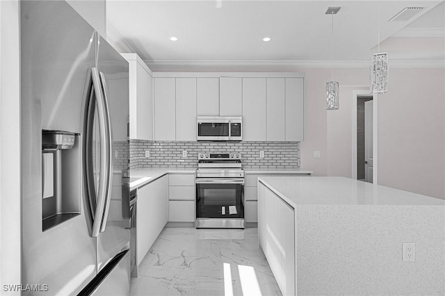 kitchen with crown molding, hanging light fixtures, white cabinets, stainless steel appliances, and backsplash