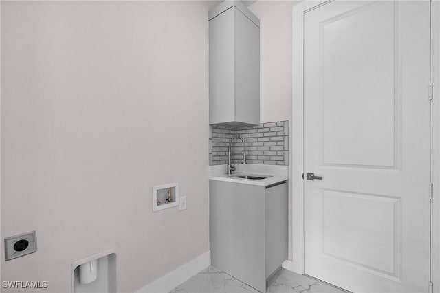 washroom with electric dryer hookup, sink, hookup for a washing machine, and cabinets