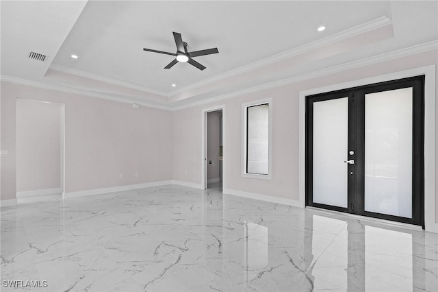 unfurnished room featuring french doors, ornamental molding, ceiling fan, and a tray ceiling