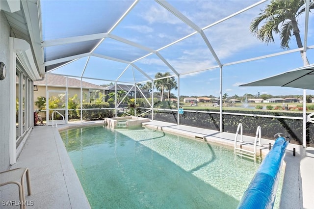 view of swimming pool featuring a pool with connected hot tub, glass enclosure, and a patio