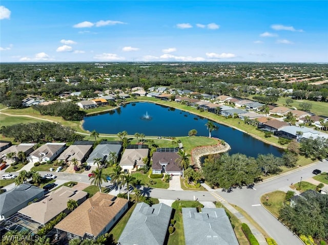 drone / aerial view with a water view and a residential view