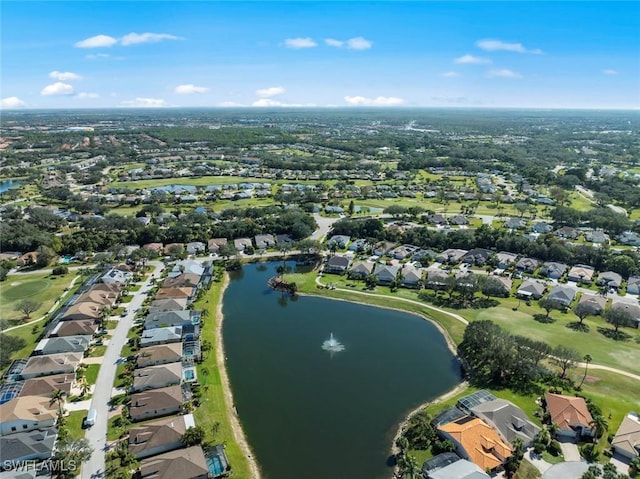 aerial view with a water view and a residential view