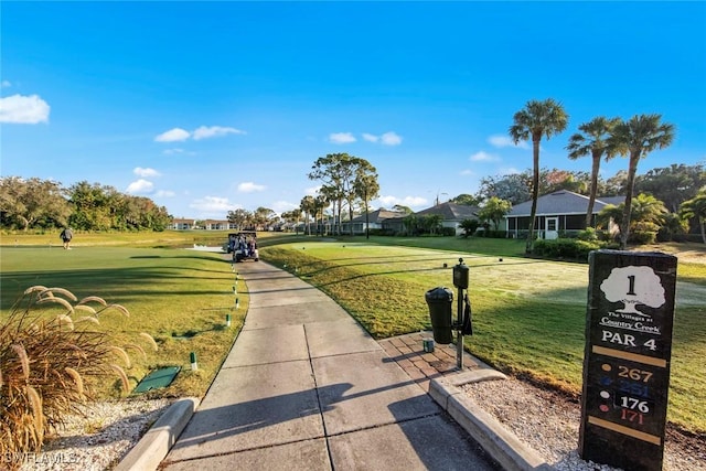 view of property's community featuring a yard