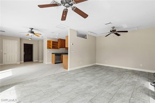 unfurnished living room with light tile patterned flooring and ceiling fan