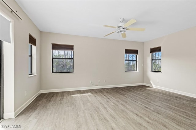 empty room featuring ceiling fan and light wood-type flooring