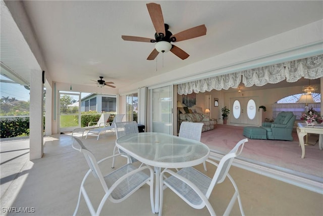 view of patio featuring ceiling fan