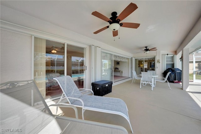 view of patio with a grill and ceiling fan