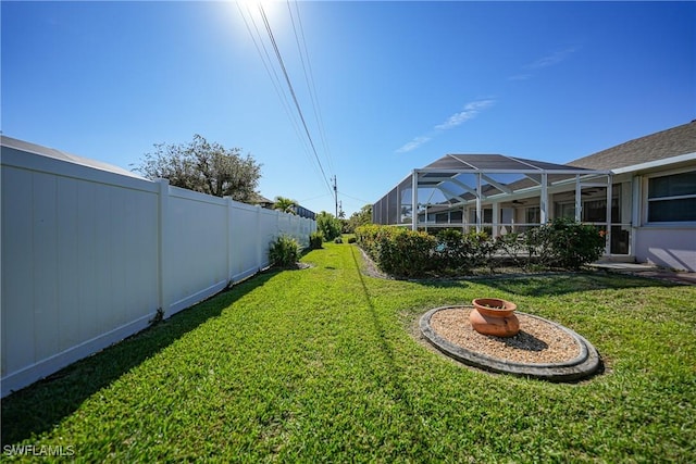 view of yard with a lanai