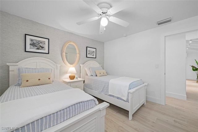 bedroom featuring ceiling fan and light wood-type flooring