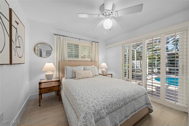 bedroom with ceiling fan and light hardwood / wood-style floors