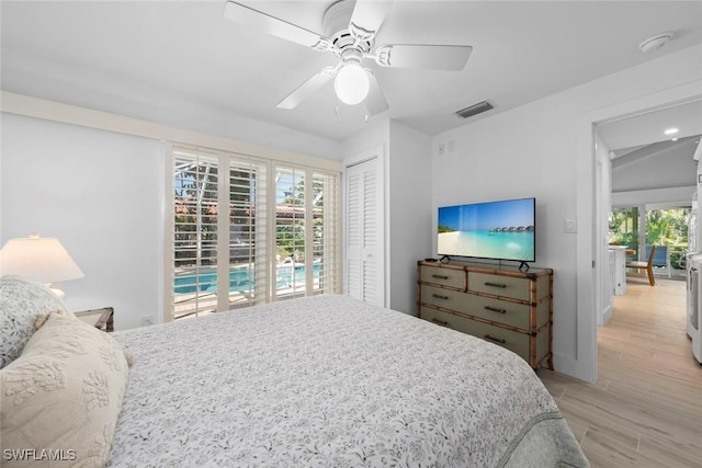 bedroom featuring a closet, access to exterior, ceiling fan, and light hardwood / wood-style flooring