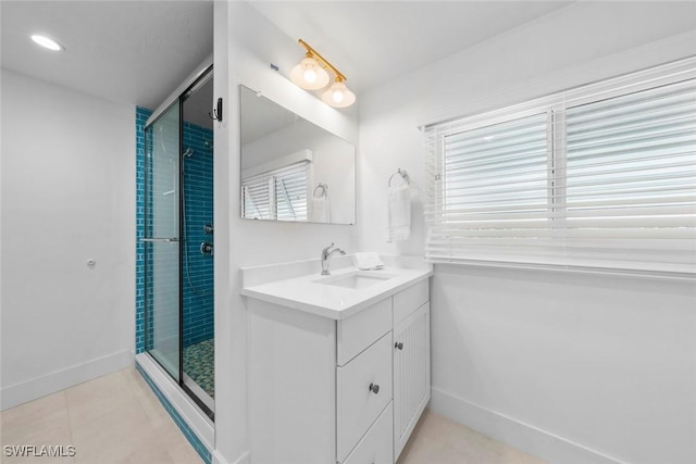 bathroom with vanity, tile patterned flooring, and a shower with door