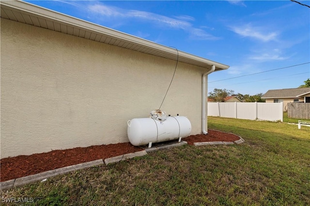 view of home's exterior with a yard