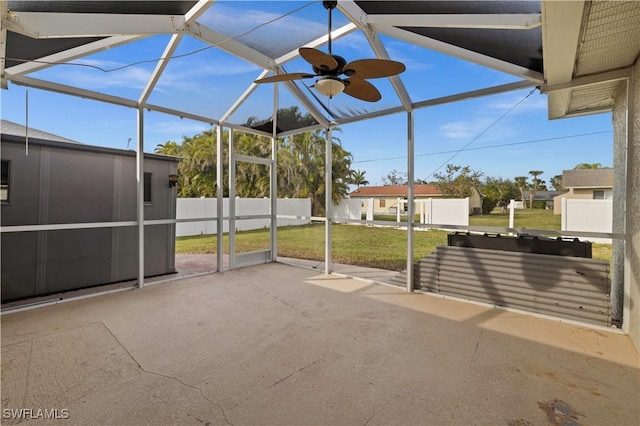 unfurnished sunroom featuring vaulted ceiling and ceiling fan