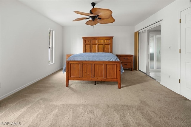 carpeted bedroom with ceiling fan and a closet