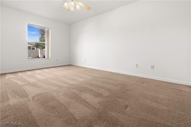 unfurnished room with light carpet and ceiling fan