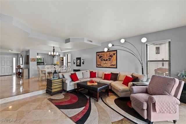 living room with a notable chandelier