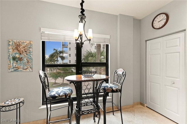 dining space with a chandelier