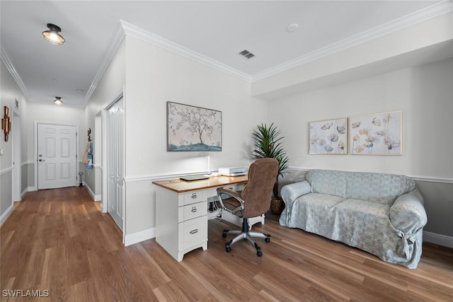 office space featuring hardwood / wood-style floors and crown molding