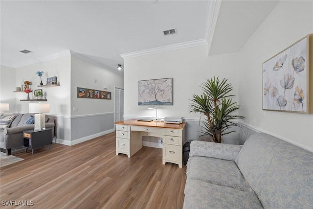 office with hardwood / wood-style floors and crown molding