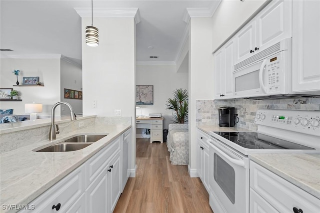 kitchen with pendant lighting, sink, white appliances, ornamental molding, and white cabinets