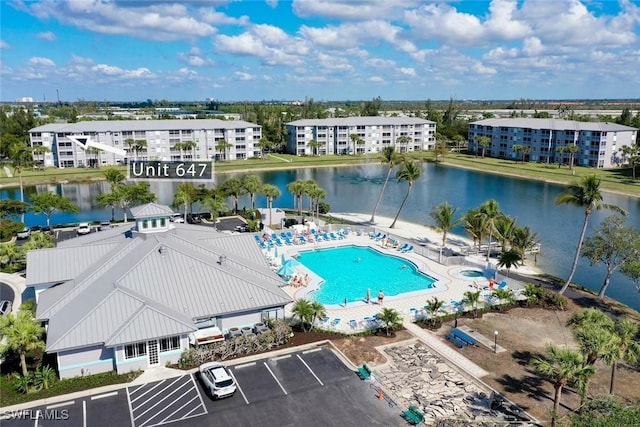 birds eye view of property with a water view