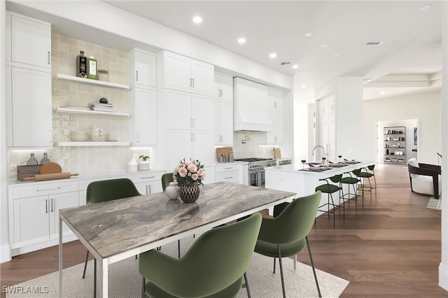 dining area with dark hardwood / wood-style flooring