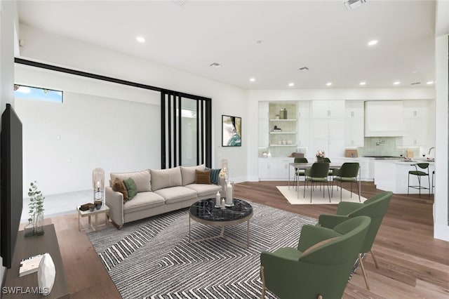 living room with light hardwood / wood-style flooring