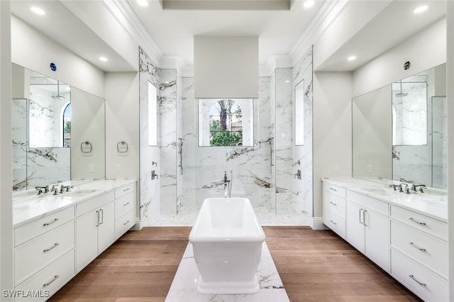 bathroom featuring crown molding, wood-type flooring, and a wealth of natural light