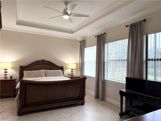 tiled bedroom with multiple windows, a raised ceiling, and ceiling fan