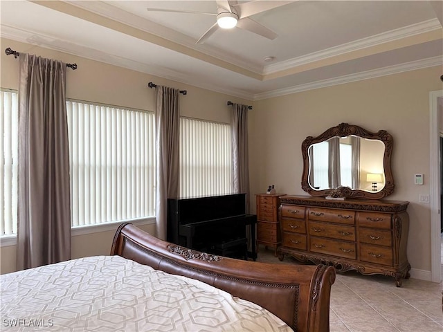 bedroom featuring a raised ceiling, ornamental molding, light tile patterned floors, and ceiling fan