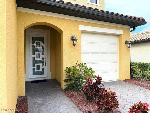 doorway to property featuring a garage