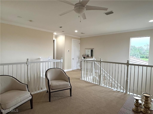 living area with light carpet and ornamental molding