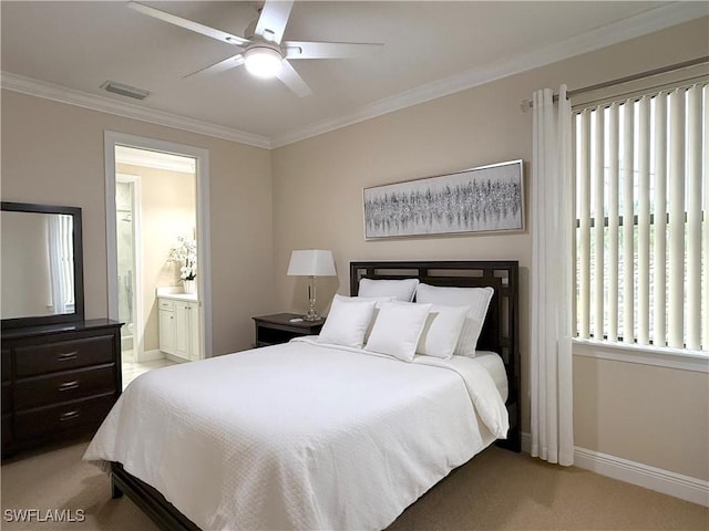 bedroom with ceiling fan, ensuite bathroom, light colored carpet, and ornamental molding